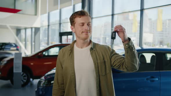 Portrait of a Happy Man with Car Keys in His Hands alt