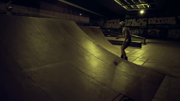 Teenage Riders Preparing Competition Together at Evening Skatepark