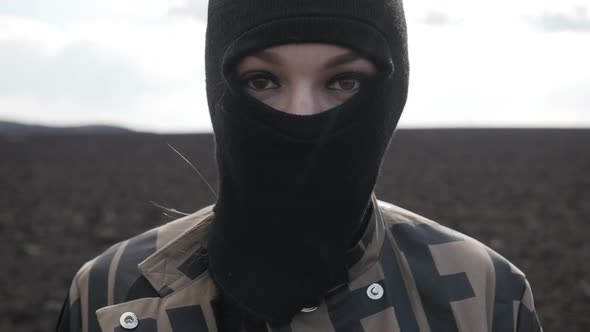Girl in Balaclava Is Holding Molotov Cocktail