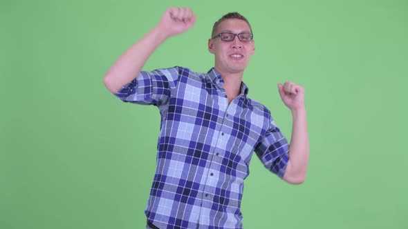 Happy Young Hipster Man Dancing alt