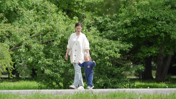 Mother and Child Walking in the Park in Summer Happy 1 alt