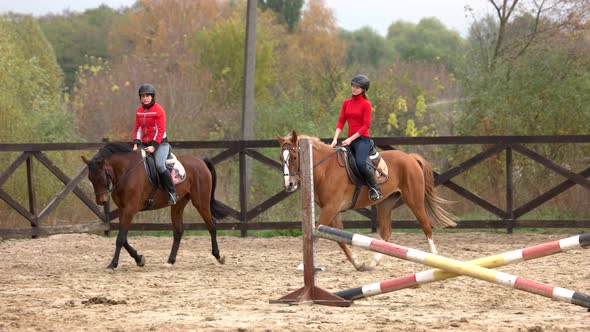 Young Women Riding Horses at Farm alt