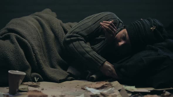 Homeless Person With Trembling Hands Trying to Light Cigarette, Getting Nervous alt