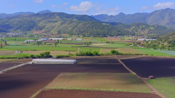 Clouds Shadowing Over Idyllic Agricultural Fields Near Constanza Valley In Dominican Republic. Aeria alt