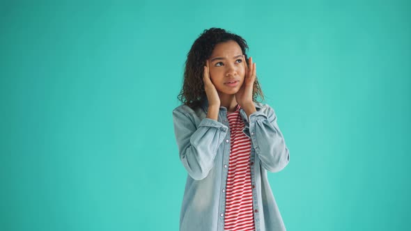 Portrait of Sick African American Woman Suffering From Headache Touching Head alt