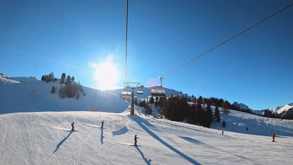 FPV POV of Cable Chair Ski Lift Ascend for Alpine Skiing in Dolomites Italy alt
