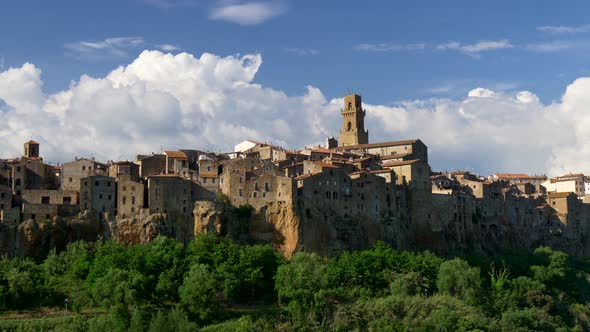 Pitigliano, Italy. Panoramic Shot of the Town with a Tower and Houses alt