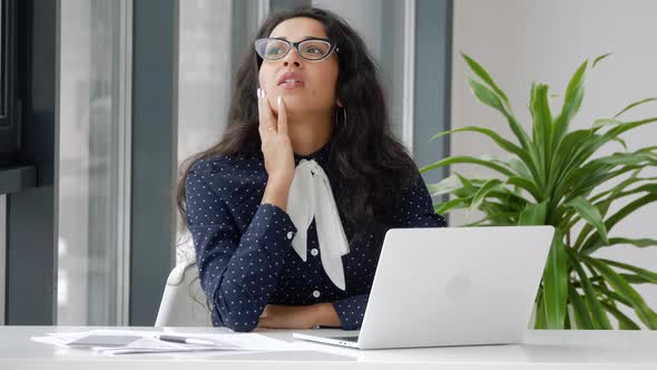 Shocked frustrated mixed race business woman student feel stressed look at computer screen.