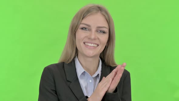 Cheerful Young Businesswoman Doing Clapping Against Chroma Key alt