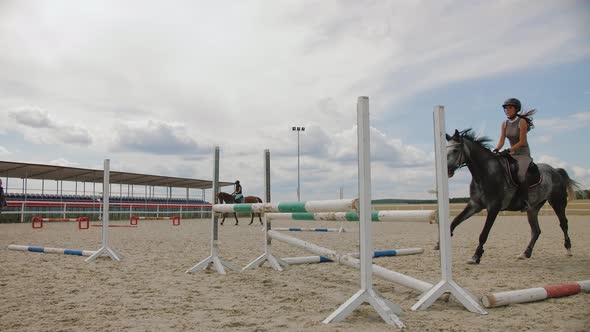 Horse Jumping Over Obstacle on Sandy Parkour Riding Arena Equestrian Competition alt