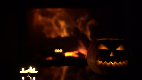  three candles on a black background with a fireplace flame.