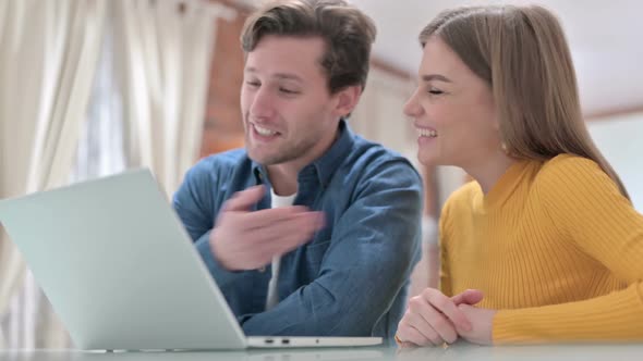 Attractive Office Colleagues Doing Video Chat on Laptop in Bedroom alt