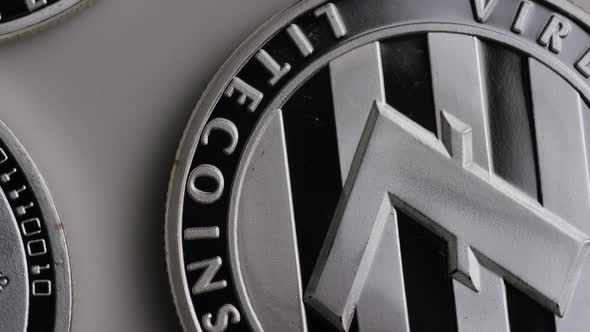 Rotating shot of Litecoin Bitcoins (digital cryptocurrency) - BITCOIN LITECOIN 0133 alt