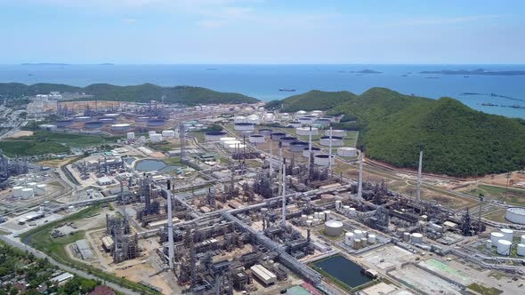 Aerial view of petrochemical oil refinery and sea in industrial engineering in Chonburi.