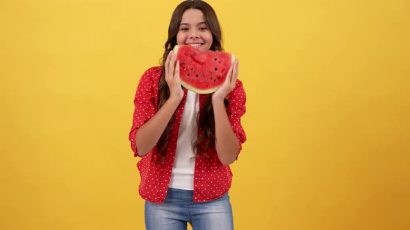 Happy Kid Showing Slice of Watermelon Fruit on Yellow Background Fruit