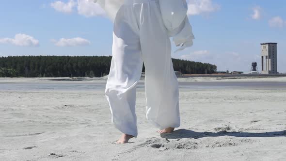 Beautiful Woman Walking on Shore