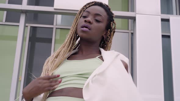 Close Up of a Young Happy Street Dancer Woman Dancing Performing Freestyle Hip Hop Moves Enjoying alt