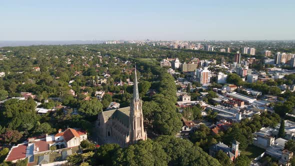 Aerial descending towards San Isidro Cathedral and Buenos Aires city on background alt