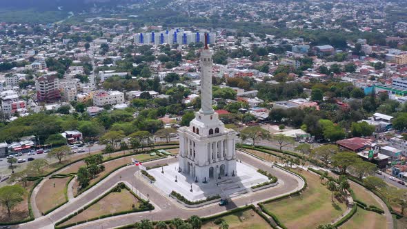Monument to heroes of restoration at Santiago de los Caballeros. Aerial orbit zoom in alt