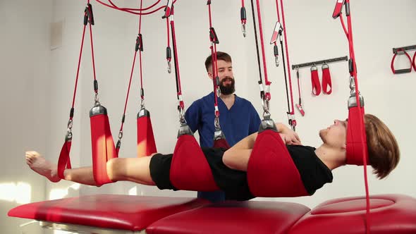 Physiotherapist Doing a Back Treatment to the Patient in Physiotherapy Room alt