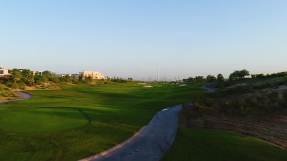 Aerial view of golf club on a luxury residential area, Dubai, U.A.E. alt