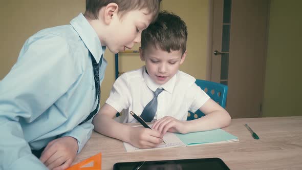 Tracking Slow Motion Pupils Do Homework Write Numbers in Notebooks Help Each Other 2 alt