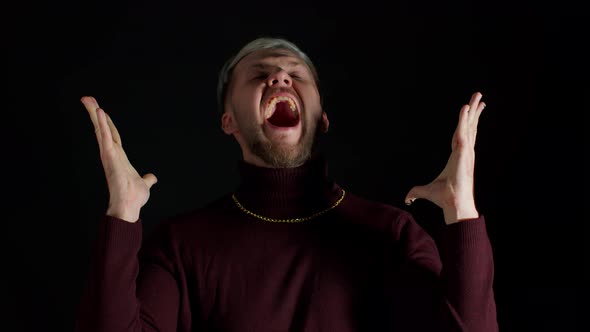 Overjoyed Young Man Wins Competition Achieves Goal and Makes Triumph Gesture Says Yes Shows Fist alt