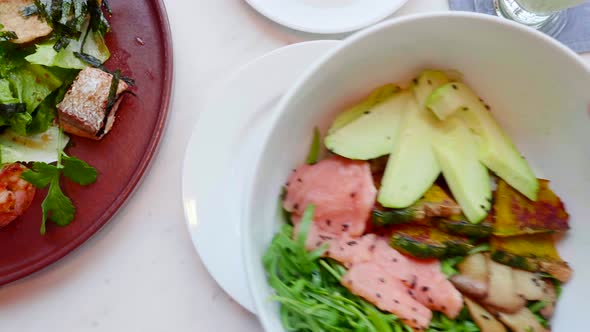 Hand Put Salmon Salad with Avocado Zucchini alt