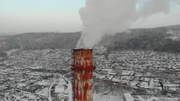 Aerial View on Power Plant Pipe with White Smoke in Winter