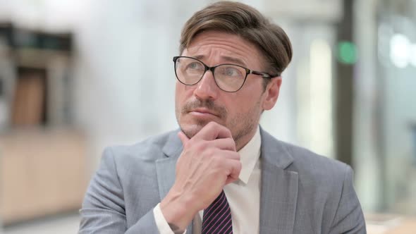 Portrait of Pensive Businessman Thinking an Idea alt