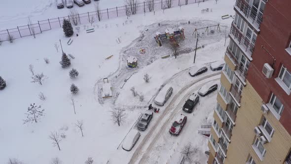 A Snow Blower Removes Snow on the Playground with the Help of Special Equipment in the Courtyard of