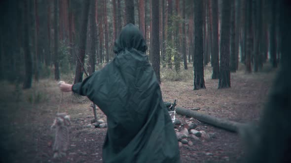 Terrible dark figure in the forest brings the key. Scene for Halloween