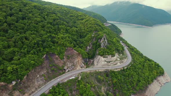 Aerial View of a Road in the Mountains and Zhinvali Dam Georgia alt