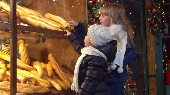 Children Choosing Bread in Bakery in Evening