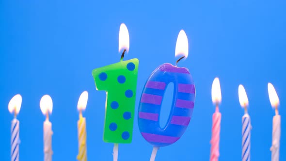 Light the Candle Number 10 for Birthday on Blue Background