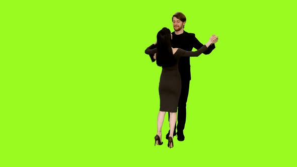 Loving Couple Dancing Against Green Background