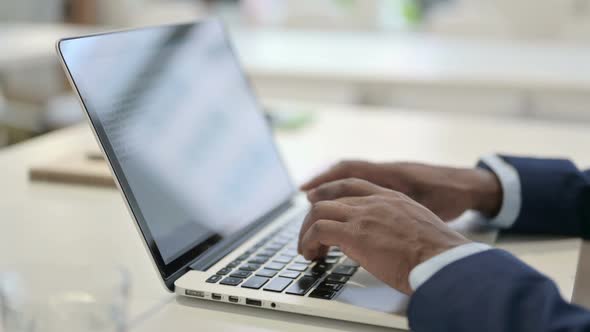 Side View of Hands of Businessman Typing on Laptop Close Up alt