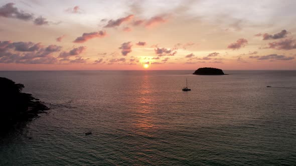 Parasailing at an Orange Sunset on the Beach alt