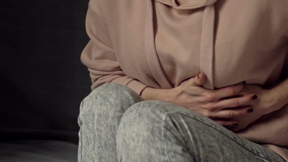 Woman Suffers From Abdominal Pain Menstrual Cramps Risk of Miscarriage Inflammation of the Appendix
