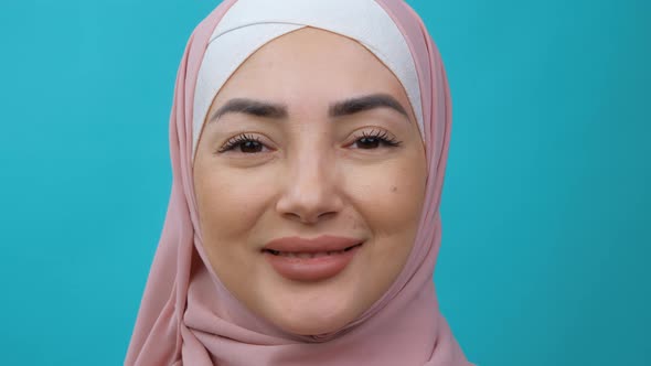 Extreme Close Up Portrait of Young Beautiful Middle Eastern Muslim Woman Wearing Hijab Looking at