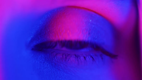 Female Blue Eye in Neon Light