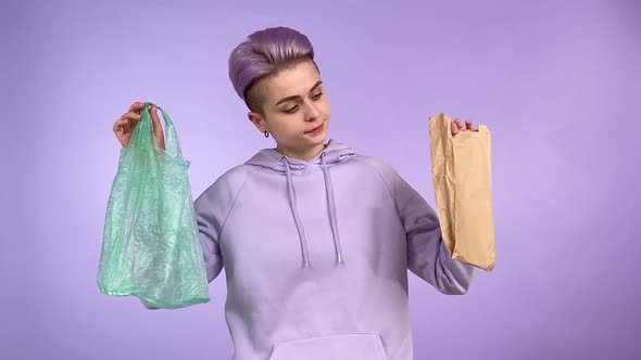 Young Adult Person Choosing Plastic or Paper Pack Isolated Indoors alt