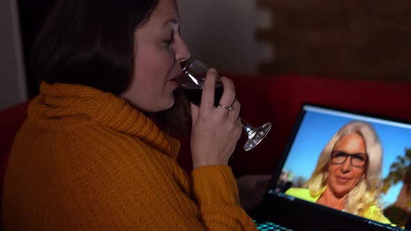 Woman Videocalling with a Glass of Wine