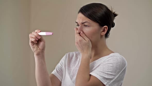 Woman is Upset By the Result of a Pregnancy Test