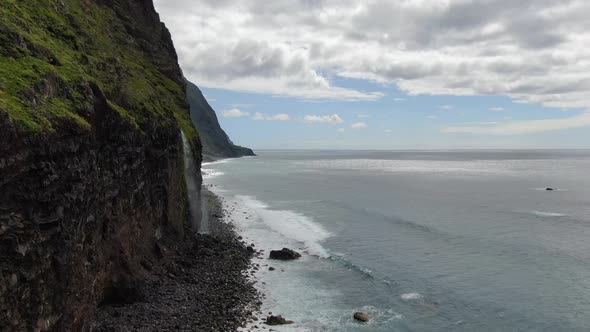 Waterfall that pours into the Atlantic Ocean, Madeira, Portugal alt