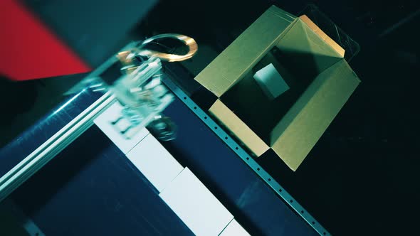 Top View of Boxes Getting Relocated By a Robot alt