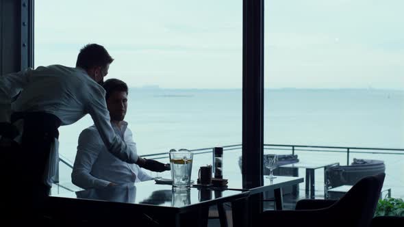 Relaxed Businessman Resting Hotel Terrace at Lunch Break alt