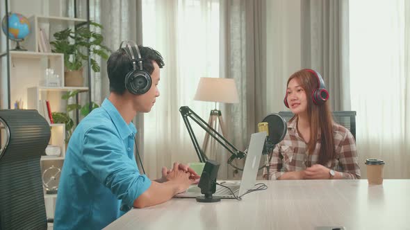 Asian Man Host Record Podcast Wear Headphone With Laptop Interview Guest Conversation For Content alt