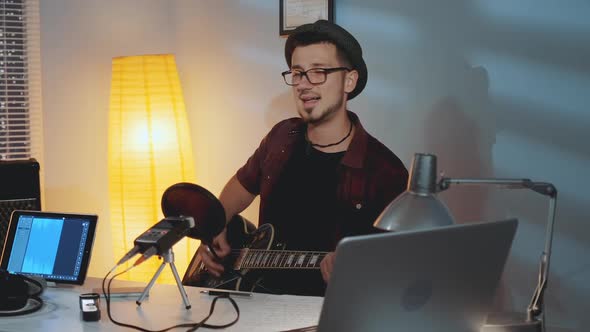 Home Recording Studio Cheerful Musician Playing Guitar and Emotionally Singing His Hit Song alt