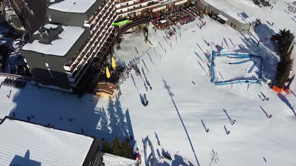 Majestic Winter Aerial Landscape and Ski Resort with Typical Alpine Wooden Houses in French Alps